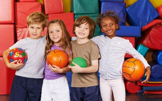 a group of kids holding basketballs