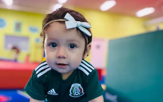 a child with a bandana on his head