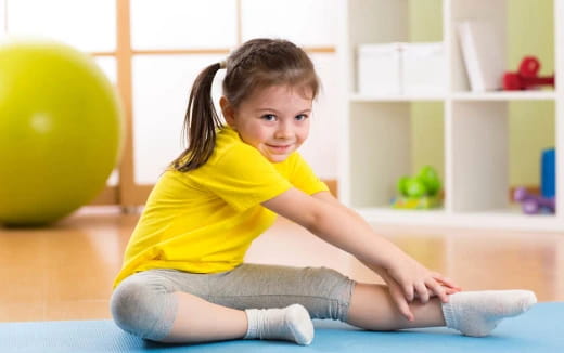 a girl sitting on the floor