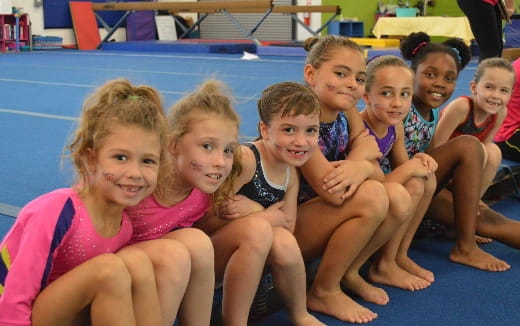 a group of children in a pool