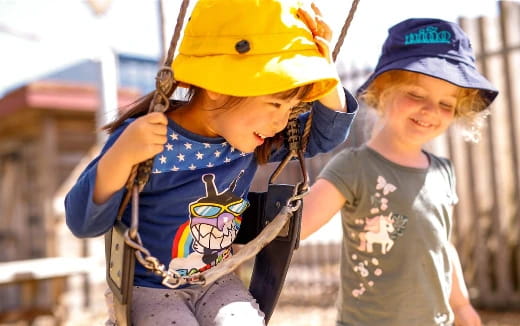 a couple of kids wearing helmets