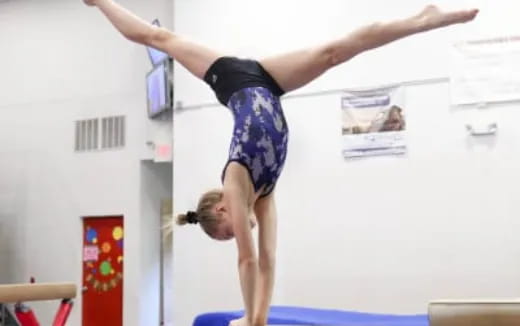 a person doing a handstand