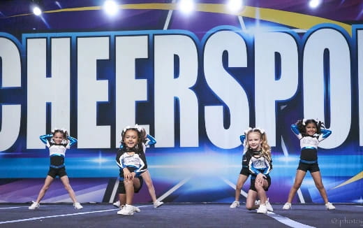a group of cheerleaders on a stage