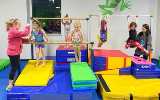 a group of children playing on a trampoline