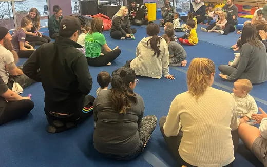 a group of people sitting on the floor