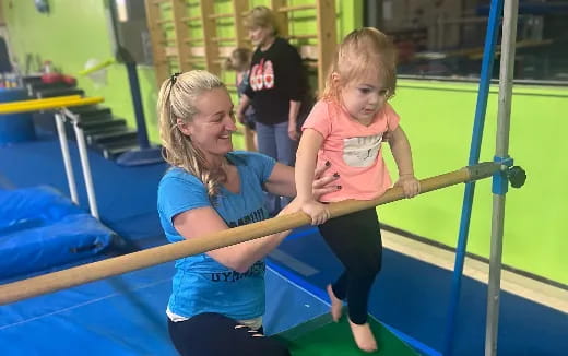 a person and a girl on a trampoline