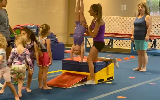 a group of children playing on a mat