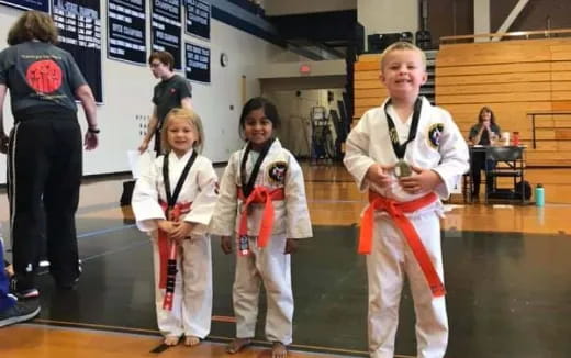 a group of women in karate uniforms