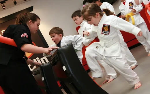 a group of people in karate uniforms