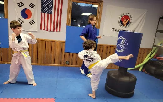 a group of kids practicing martial arts