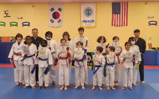 a group of people in karate uniforms