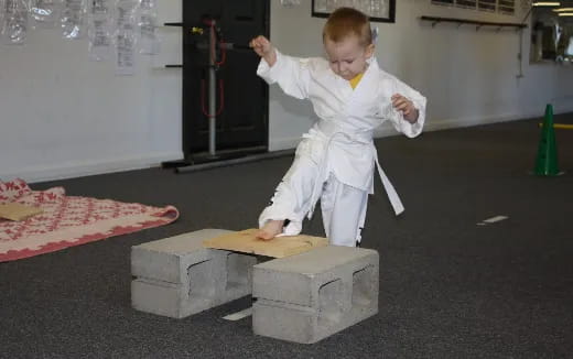 a child in a white suit