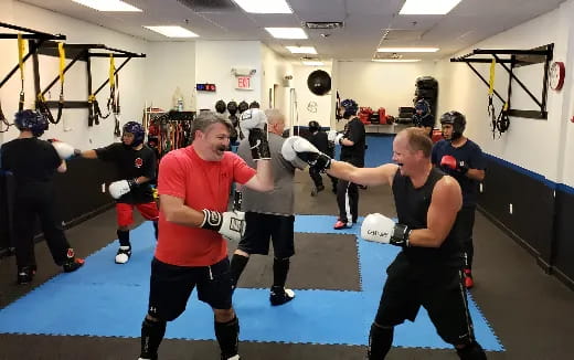 a group of people in a gym