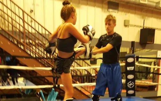 a man and a woman in a boxing ring