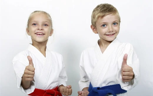 a couple of children posing for the camera