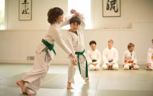 a group of kids practicing karate