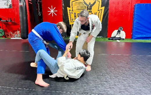 a group of people in karate uniforms