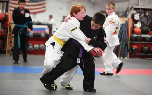 a group of people in karate uniforms