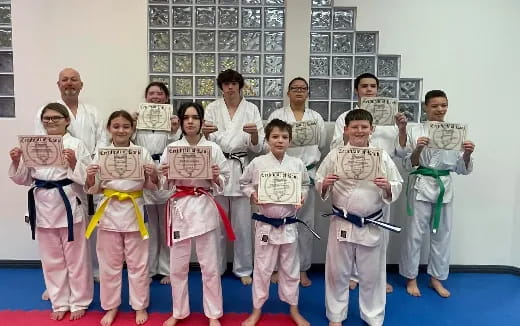 a group of people in karate uniforms