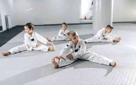 a group of people in karate uniforms