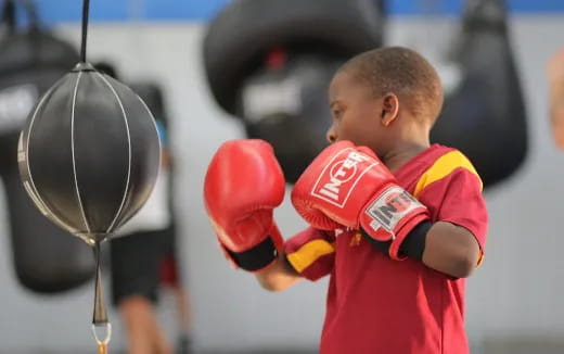 a child boxing with boxing gloves