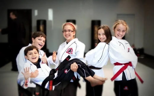 a group of people in karate uniforms