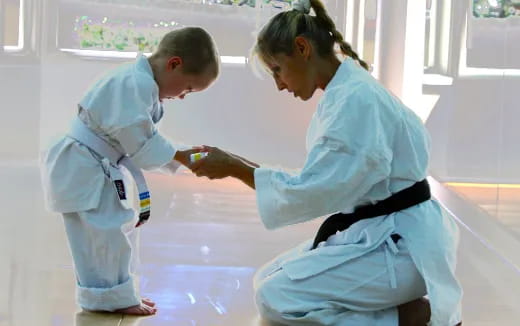 a person and a boy in white lab coats