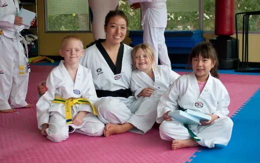 a group of people in karate uniforms