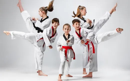 a group of people in karate uniforms