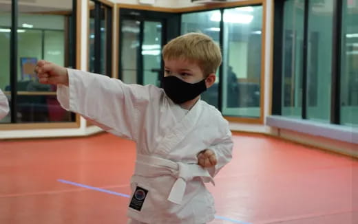 a boy in a karate uniform