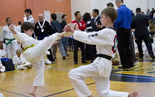 a group of people in karate uniforms