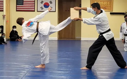 a couple of people in karate uniforms