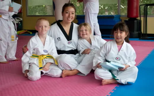 a group of people in karate uniforms