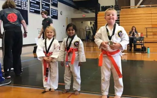 a group of women in karate uniforms