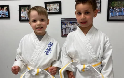 a couple of boys in white shirts