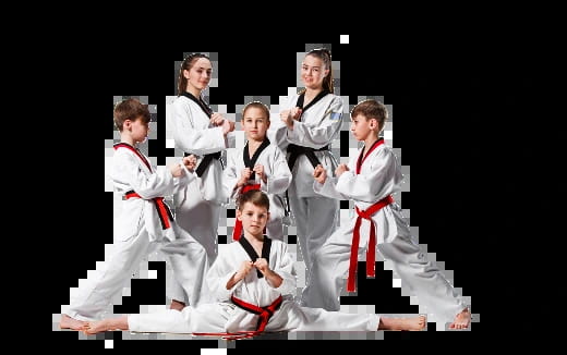 a group of boys in karate uniforms