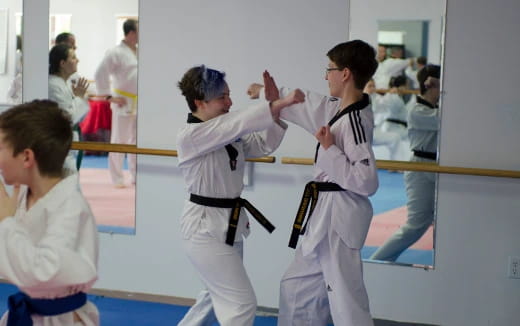 a group of people in karate uniforms