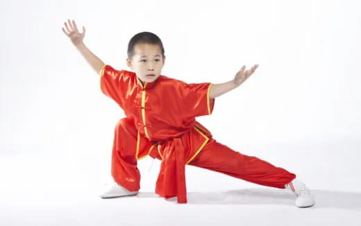 a boy in a red suit