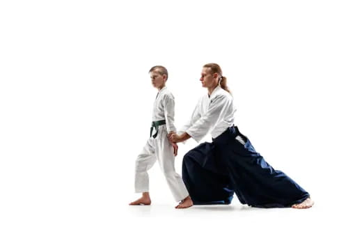 a man and a woman in karate uniforms