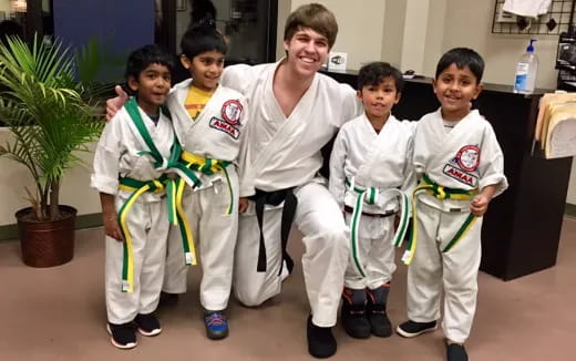 a group of boys in karate uniforms