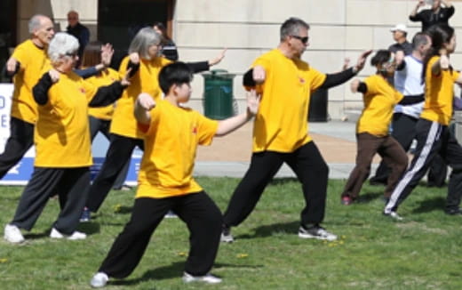 a group of people in yellow shirts