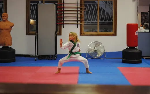 a girl dancing on a mat