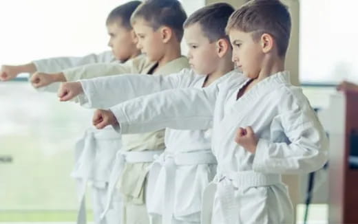 a group of children in white lab coats