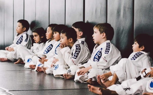 a group of boys sitting on the floor