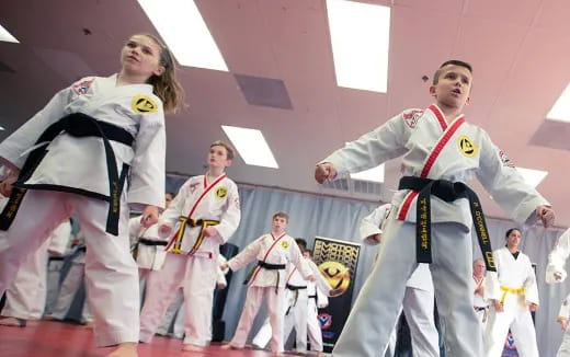 a group of people in karate uniforms