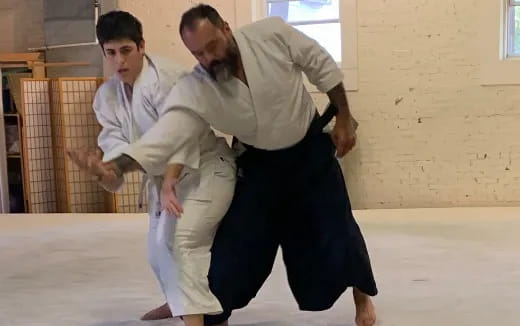 a group of men in karate uniforms