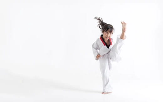 a person in white karate uniform