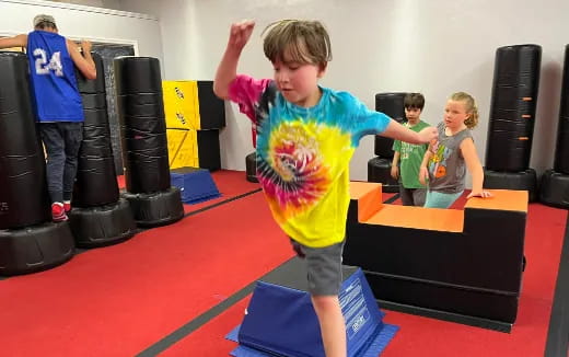 a group of kids in a gym