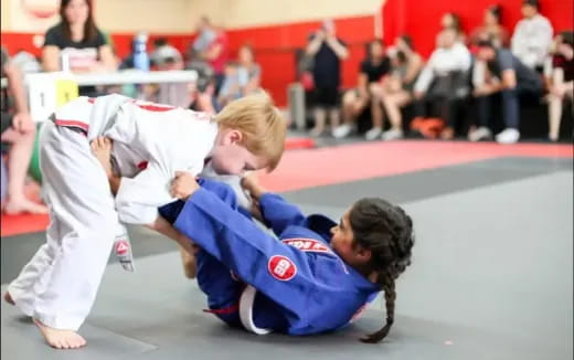 a group of people in karate uniforms