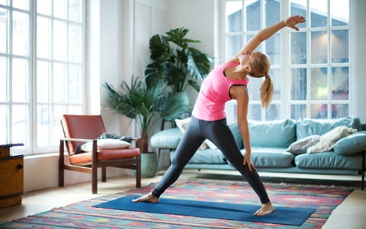 a woman dancing in a living room